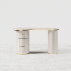 a white table with gold trimmings on the top and two drawers underneath it