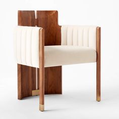 a wooden chair with white upholstered fabric on it's back and sides