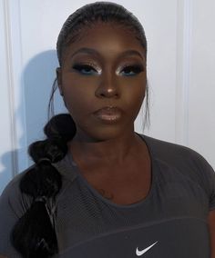 Royal Blue Eye Makeup Black Women, Gold And Green Prom Makeup, Metallic Makeup Black Women, Silver Under Eye Makeup, Green Under Eye Makeup Looks, Gold Under Eye Makeup, Under Eye Makeup Black Women, Blue And Silver Makeup Looks Black Women, Sliver Makeup Ideas