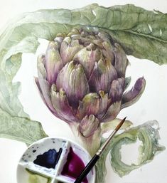 a painting of an artichoke with watercolor paints and a brush in front of it