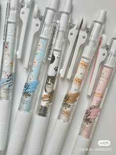 several different types of pens lined up next to each other