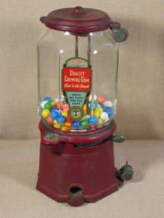 an old fashioned gummy machine filled with candy