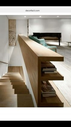 there is a staircase leading up to the second floor in this modern home with white walls and wood floors