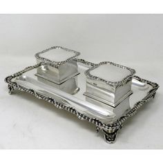 a silver tray with two serving dishes on it