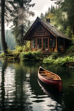 a canoe is sitting in the water near a cabin with a porch on it's roof