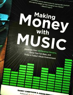 the book making money with music is sitting on a table