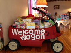 a welcome wagon filled with books and toys