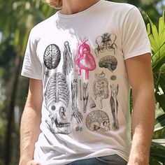 a man wearing a white t - shirt with different types of human body parts on it