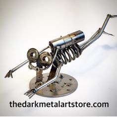 a metal sculpture with multiple parts attached to it