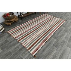 a striped rug on the floor in a living room