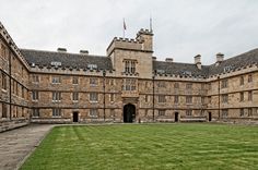 an old building with grass in front of it