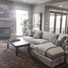 a living room filled with furniture and a fire place