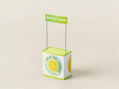 a small carton box with a lemon slice on the side and a sign that says,