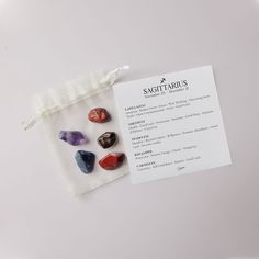 some rocks are in a bag on a white surface with a label that says samgettraulis