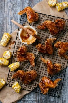 chicken wings with bbq sauce and corn on the cob