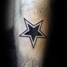 a man's arm with a star tattoo on the side of his left leg