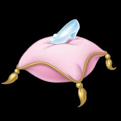 a pink pillow with a blue shoe sitting on it's end and gold trimmings