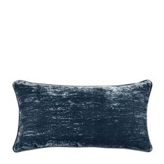 a blue velvet pillow on a white background