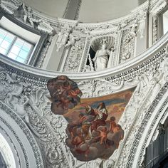 an ornate ceiling with paintings on it