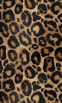 an animal print fabric with black and brown spots