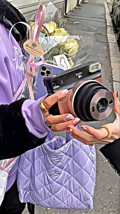 a woman is holding a camera and taking a picture