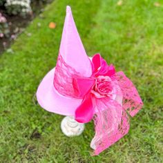 Light pink witch hat pink witch hat is named in honor of the remarkable Bridget Bishop. Bridget, a courageous woman was the first to be executed for witchcraft during the infamous Salem Witch trials of 1692. This hat stands as a testament to Bridget's indomitable spirit. Adorned in a gentle shade of light pink, this hat is elegantly layered with delicate tulle, a testament to Bridget's grace and resilience. Vibrant flowers embellish its design, symbolizing her inherent power and strength that tr Bridget Bishop, Pink Witch Hat, Courageous Woman, Witches Night, Witches Night Out, Pink Witch, Black Witch Hat, Salem Witch Trials, Witch Trials