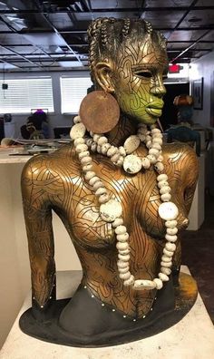 a statue is shown with beads on it