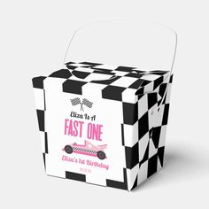 a black and white checkered box with a pink car on it's side