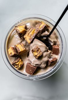 a dessert in a glass with chocolate and marshmallows