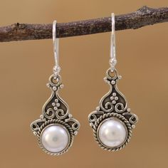 Cultured pearls shine in tandem in these dangle earrings from Alok Jain. Each gem is held within a rope design and crowned with dots and curls of sterling silver. An oxidized finish that gives the earrings a charming antique appearance. Elegant Silver Pearl Earrings With French Hook, Ornate Dangle Pearl Drop Earrings, Silver Dangle Pearl Earrings With French Hook, Pearl Earrings With French Hook For Gift, Marcasite Jewelry, Pearl Accessories, Pearl Dangle Earrings, Silver Jewelry Design, Silver Dangle Earrings