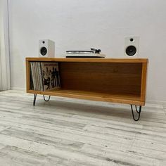 Showcase your turntable and vinyl record collection. Perfect for music lovers who need a record player stand and storage for records. The handcrafted design ensures that each unit is unique and made to the highest standards. Wood Thickness: 1.5 in Length (left to right): 45 in Depth: (front to back): 14 in Wooden External Height: 16 in Internal Height: 13 in Hairpin Leg Height: 6 in Unit with Legs Height: 22 in Size: 45".  Color: Brown. Record Organizer, Storage Entertainment Center, Record Shelf, Entertainment Center Design, Record Player Stand, Vinyl Record Collection, National City, Tv Stand And Coffee Table, Marble Tile Floor