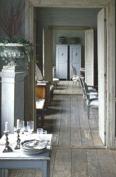 an empty room with chairs and tables in it