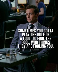 a man in a suit sitting at a table with a quote about playing the role of a fool, who thinks they are folling you