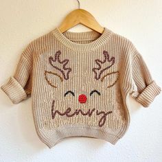 Custom Name Reindeer Baby Deer First Christmas Sweatshirt, Cute X-mas Baby Sweater, Fall Autumn Baby Shower Newborn Announcement Gifts Keep your little one cozy in our baby sweatshirt, made from soft, premium cotton blend fabric for maximum comfort. This lightweight yet warm sweatshirt is gentle on delicate skin, perfect for everyday wear. The ribbed cuffs and hem ensure a snug fit, while the easy-to-pull-over design makes dressing a breeze. Available in a variety of adorable colors and prints, Newborn Christmas Outfit Boy, Embroidery Sweater Diy, Baby Christmas Sweater, Newborn Christmas Outfit, Newborn Announcement, Boys Christmas Outfits, Diy Baby Gifts, Newborn Christmas, Embroidery Sweater