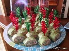 there are many rolls on the plate with christmas decorations