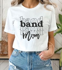 Band Mom Shirt, Marching Band Mom, Band Mom Life Tee, Drumline Mama, Gift for Band Mom, All About Halftime Shirt, Band Mama Shirt Bella Canvas 3001T:  T-Shirt Sizing Please reference the size chart before selecting shirt size.  Use one of your own t-shirts to measure the size and fit.  Then compare with the size chart provided to ensure an accurate fit. T-Shirt Materials 100% combed and ring-spun cotton. Heather colors are 90% combed and ring-spun cotton, 10% polyester. Pre-shrunk fabric. Should White Cotton Shirt With Band Logo, White Cotton Band Logo Top, White Cotton Top With Band Logo, White Cotton Shirt With Lettering, Cotton Band Merch Tops With Lettering, Band Mom Shirts Ideas, Marching Band Mom, Band Mom Shirts, Drum Major