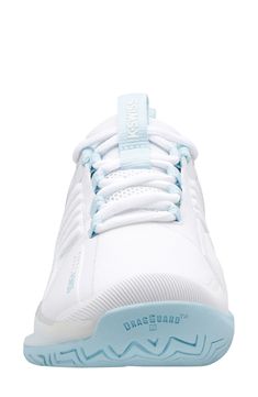 the white and blue tennis shoe is shown on a white background with light blue accents