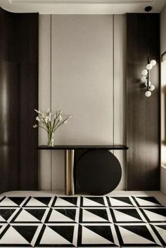 a black and white floor with a table in the middle