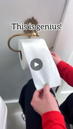 someone is cleaning the toilet with a paper towel