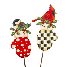 two christmas decorations made to look like birds