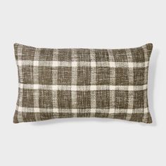 a brown and white checkered pillow