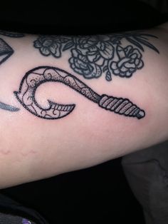 a close up of a person's arm with a tattoo design on the arm