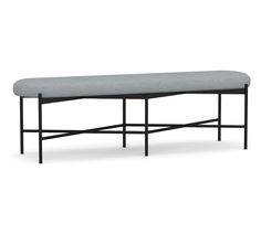 the bench is made from metal and has a gray upholstered cushion