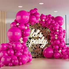 pink balloons in front of a happy new year sign with the words happy on it