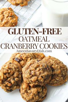 gluten - free oatmeal cranberry cookies on a plate next to a glass of milk