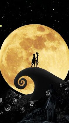 a couple standing on top of a hill under a full moon