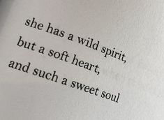 an open book with the words she has a wild spirit, but a soft heart, and such a sweet soul