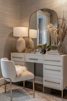 a white desk with a mirror and chair in front of it on top of a rug