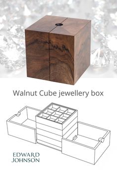 the walnut cube jewelry box is shown with its lid open