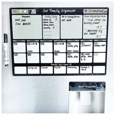 a white refrigerator with magnets and writing on it